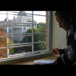 Tenant signs off on the inspection report for her new, green, apartment with a view overlooking the Ursuline Bedford Park convent.