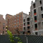 Buildings are growing. From left to right: former St. Mary's Hall, Serviam Gardens # 2 and Serviam Tower # 1.